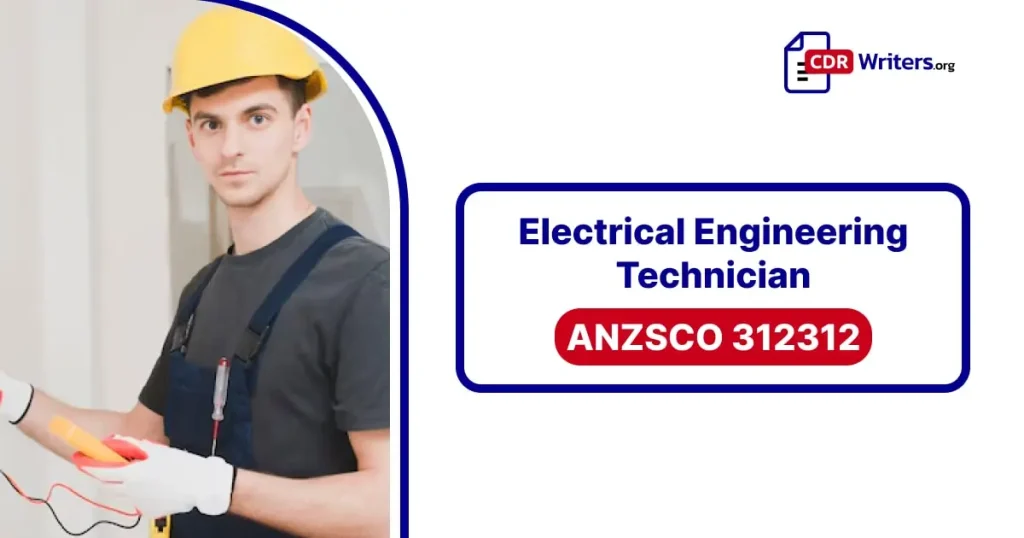 A male electrical engineering technician holds a testing device and tools, wearing a hard hat and work attire in a professional setting.